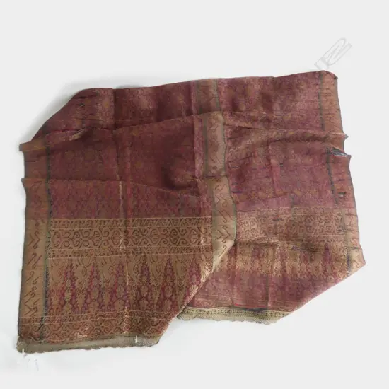 A length of Indonesian fabric with metal thread. Some distress.